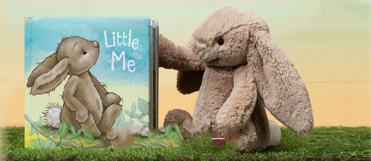 None Image of Jellycat Bunny with a Jellycat Bunny Book sitting on grass.