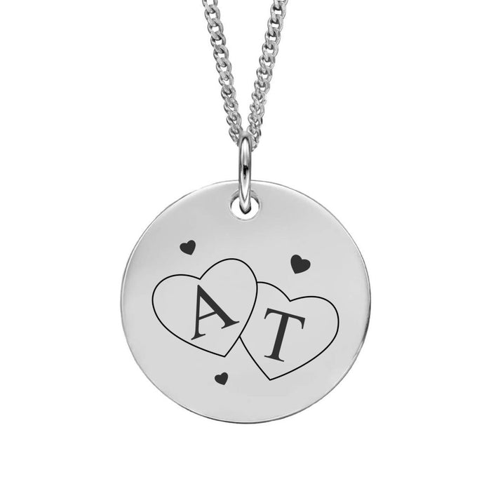 Silver necklace with a round pendant featuring interlocking hearts with initials 'A' and 'T'. Initials can be personalised.