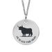 Silver necklace with a round pendant featuring a black silhouette of a highland cow and text on a white background.